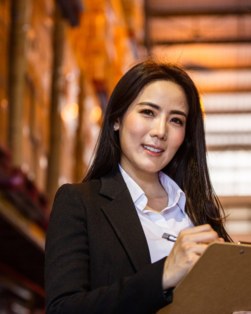 asian-business-woman-smiling-and-holding-clipboard-2025-03-10-05-20-47-utc (1)